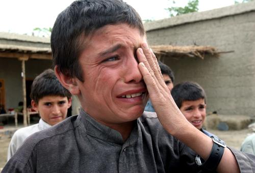 An Afghan boy cries after his two uncles were killed as his father is detained during a U.S.-led raid in Khogyani district of Nangarhar province, east of Kabul, Afghanistan on June 29. Four U.S. troops died in a roadside blast on Monday as more than 50 su Rahmat Gul, The Associated Press
