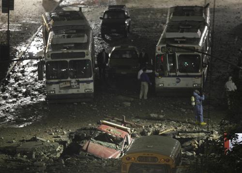 A truck lies in a hole in the street after a steam explosion in midtown Manhattan, New York, Wednesday, July 18, 2007. Seth Wenig, The Associated Press
