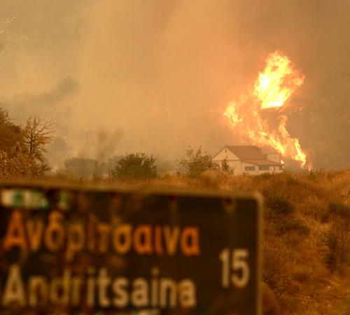 Flames reach a church at Zoodoho Pigi outside of Andritsena village in Pelloponise peninsula on Monday August 27 2007. Several villages in the area were evacuated as massive forest fires, fanned by strong winds, swept through swathes of southern Greece le Nikolas Giakoumidis, The Associated Press
