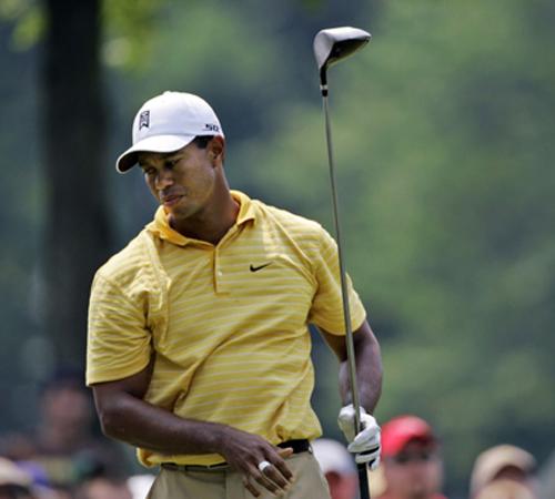 Tiger Woods looks away after this tee shot on the ninth hole at Firestone Country Club in Akron, Ohio, during the first round of the Bridgestone Invitational golf tournament Thursday, Aug. 2, 2007. Woods is one shot back at 2-under par. Amy Sancetta, The Associated Press
