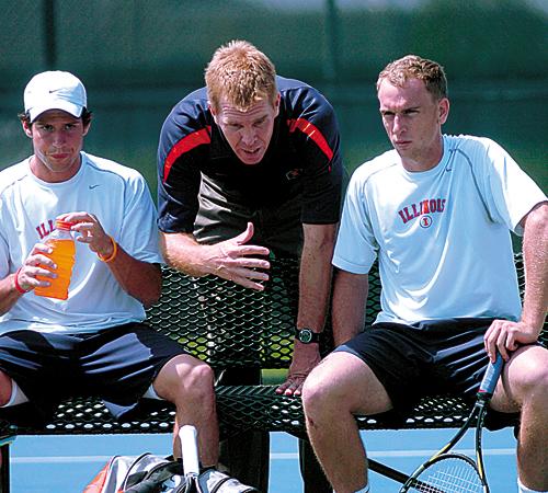 Assistant coach Kent Kinnear talks with senior G.D. Jones (right) and junior Marc Spicijaric during their doubles in this April 22 file photo at the Atkins Tennis Center. ME Online
