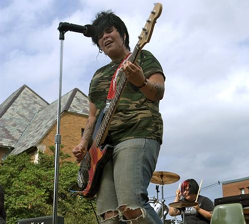 Jen Alva, of Girl in a Coma, plays the bass at the Taste of Nevada street festival on Tuesday. Erica Magda
