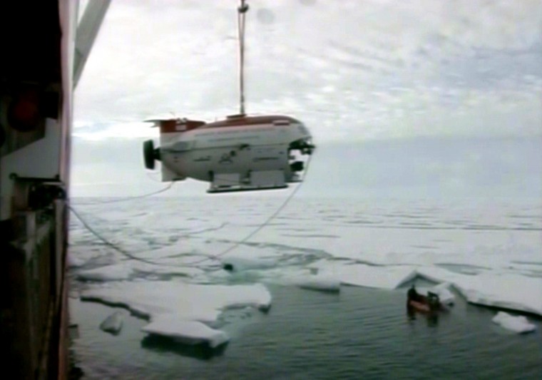 n this image made from an RTR television broadcast, a Russian miniature submarine is lowered from the research vessel Akademik Fyodorov moments before performing a dive in the Arctic Ocean beneath the ice at the North Pole Thursday, Aug. 2, 2007. Two deep The Associated Press
