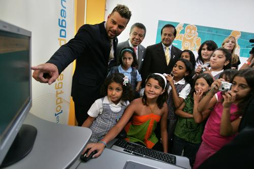Pop singer Ricky Martin demonstrates to children some educational features of a program to prevent online child predation, part of a joint initiative by Microsoft and the Ricky Martin Foundation which he is promoting, in Caguas, Puerto Rico, Wednesday, Au Brennan Linsley, The Associated Press
