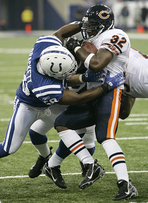Michael Conroy The Associated Press, Chicago Bears running back Cedric Benson, right, is tackled by Indianapolis Colts linebacker Gary Brackett after a short gain in the first quarter. THE ASSOCIATED PRESS, MICHAEL CONROY
