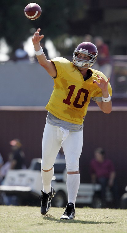 USC quarterback John David Booty practices with his team in Los Angeles on Aug. 10. Booty, who struggled with numerous injuries early on in his career and backed up Matt Leinart for years, returned for his fifth year of eligibility and was named team co-c THE ASSOCIATED PRESS, REED SAXON
