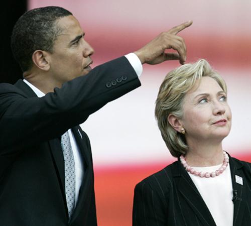 Democratic presidential hopefuls Sen. Barack Obama, D-Ill., left, and Sen. Hillary Rodham Clinton, D-N.Y., talk after a presidential forum hosted by the AFL-CIO at Soldier Field in Chicago, Tuesday, Aug. 7, 2007. Jerry Lai, The Associated Press
