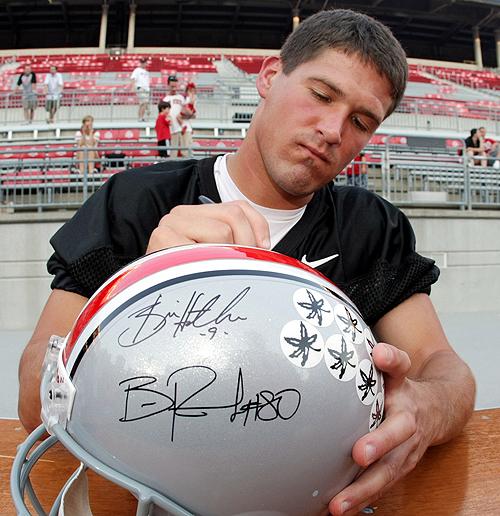 Newly named starting Buckeye quarterback Todd Boeckman signs a helmet before practice at Ohio Stadium on Thursday in Columbus, Ohio. THE ASSOCIATED PRESS, TERRY GILLIAM
