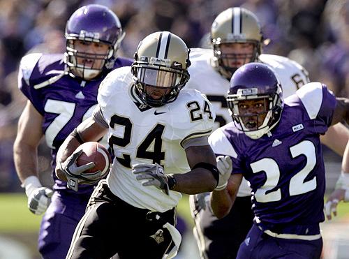 Purdue running back Kory Sheets runs past Northwestern defenders John Gill, left, and Deante Battle (22) during the first quarter of a football game in this Oct. 14, 2006 file photo in Evanston, Ill. Sheets, who ran for 780 yards and 11 touchdowns and cau THE ASSOCIATED PRESS, JEFF ROBERSON
