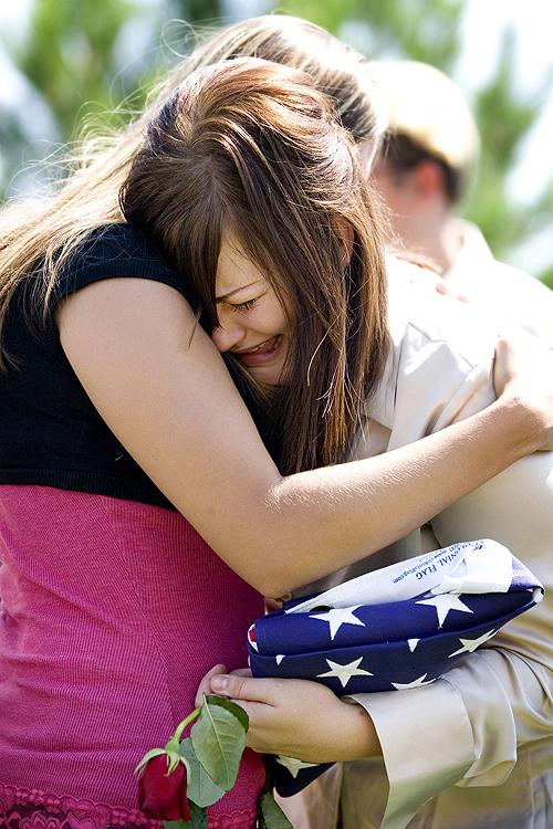 Ashley Pruitt cries during the funeral of her father on Tuesday, in Huntington, Utah. He died in the Murray mines. THE ASSOCIATED PRESS, JENNIFER ACKERMAN
