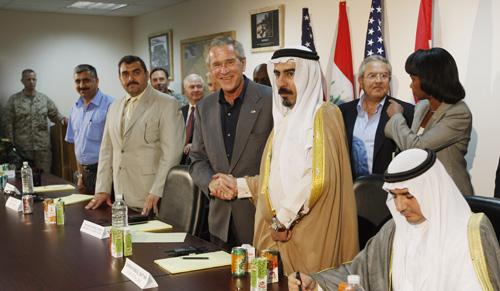 President Bush shakes hands with Abdul-Sattar Abu Risha, right, leader of the Anbar Salvation Council, also known as the Anbar Awakening - an alliance of clans backing the Iraqi government and U.S. forces - during a meeting with tribal leaders at Al-Asad Charles Dharapak, The Associated Press
