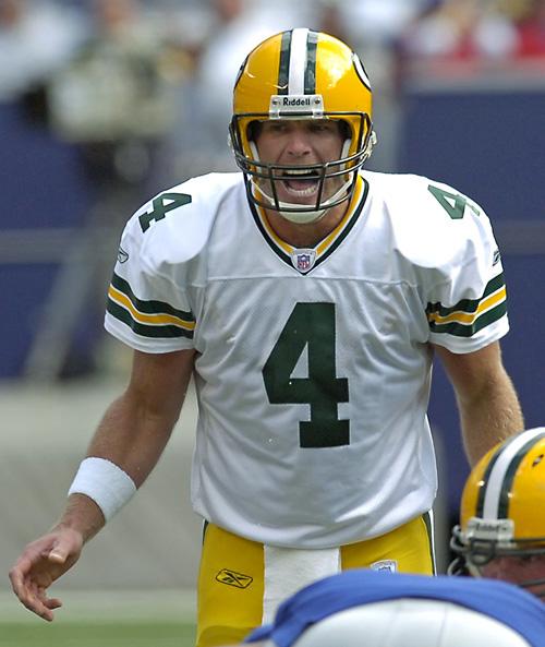 Brett Favre yells signals in the fourth quarter on Sunday at Giants Stadium in East Rutherford, N.J. Favre needs four more touchdown passes and three more interceptions to break the all-time records for each, respectively. THE ASSOCIATED PRESS, BILL KOSTROUN
