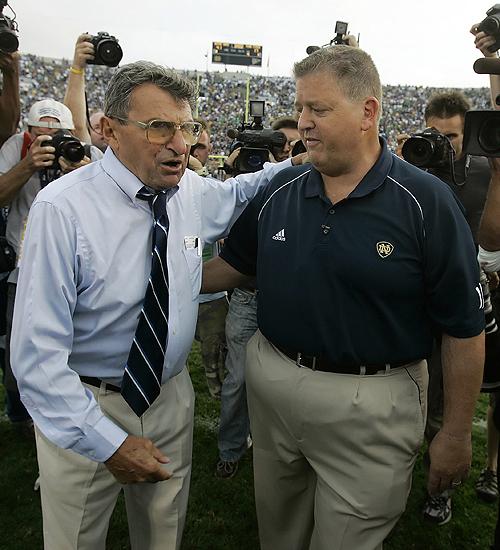 Notre Dame quarterback Jimmy Clausen (7) gets instructions from coach Charlie Weis in the second quarter of college football action against Penn State at State College, Pa., Saturday. THE ASSOCIATED PRESS, MICHAEL CONROY
