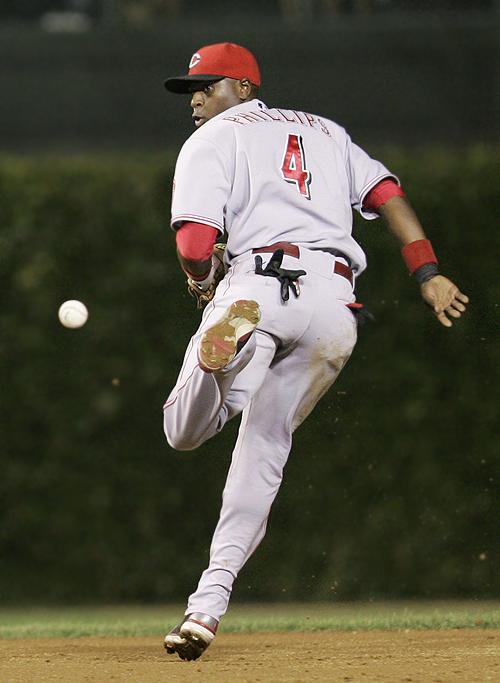 Carlos Zambrano heads back to the dugout after striking out in the fifth inning against the Cincinnati Reds at Wrigley Field in Chicago on Tuesday. THE ASSOCIATED PRESS, CHARLES REX ARBOGAST
