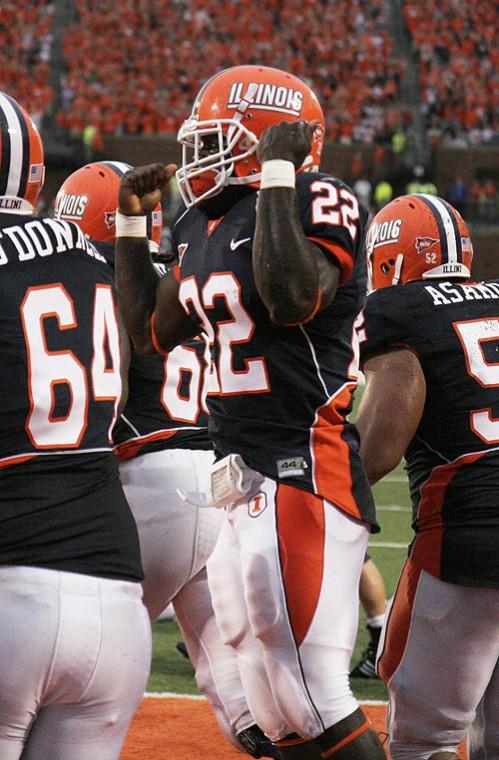 Illinois running back Daniel Dufrene, center, celebrates his touchdown during the home game against Western Illinois on Saturday. Erica Magda
