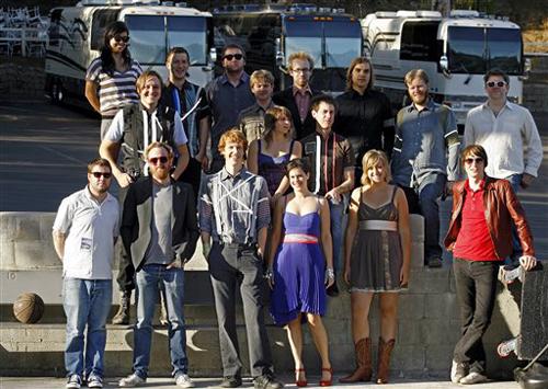 Members of the bands Arcade Fire/LCD Soundsystem pose for a group photo in front of their buses at the Hollywood Bowl in Los Angeles, Thursday, Sept. 20, 2007. The two bands, Arcade Fire headed by Win Butler, wearing black vest far left in second row, and Damian Dovarganes, The Associated Press
