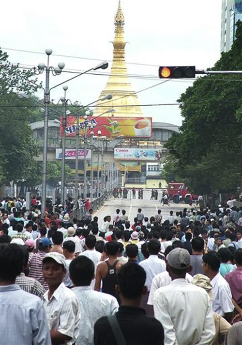 Anti-government demonstrators stand in front of riot police in Yangon, Myanmar on Thursday Sept. 27, 2007. Soldiers fired automatic weapons into a crowd of anti-government demonstrators Thursday, during clashes that killed at least nine people including a The Associated Press
