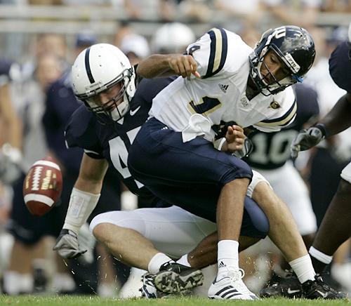 Penn State linebacker Sean Lee, left, strips the ball away from Florida International quarterback Wayne Younger during the first half of their game in State College, Pa., on Saturday. Penn State soon recovered the fumble. THE ASSOCIATED PRESS, CAROLYN KASTER
