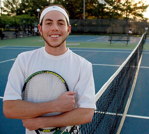 Brandon Burr, junior in kinesiology, stands on a tennis court at the Atkins Tennis Center after practicing on Wednesday. He will be competing in the Maccabi Games, an international tennis tournament, in Buenos Aires, Argentina, this December. Erica Magda
