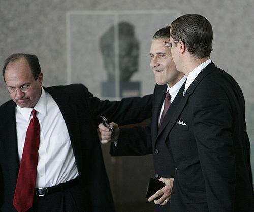 Attorney Ralph Meczyk, left, leads his client, retired Chicago police officer Anthony Doyle, center, to federal court on Monday for the reading of the verdict in the Family Secrets mob trial in Chicago. Doyle and four other men, all charged with racketeer THE ASSOCIATED PRESS, JERRY LAI
