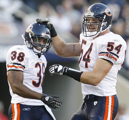 Chicago Bears safety Danieal Manning, left, celebrates with linebacker Brian Urlacher after Manning intercepted a pass against the Kansas City Chiefs during the fourth quarter on Sunday in Chicago. The Associated Press
