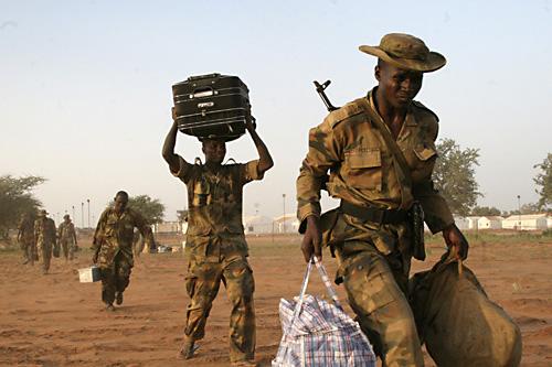 African Union peacekeepers evacuate an African Union camp in Haskanita, northern Darfur, Sudan, on Sunday. The Associated Press
