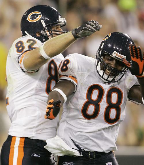 Chicago Bears tight end Desmond Clark (88) is congratulated by tight end Greg Olsen (82) after catching a touchdown pass against the Packers in Green Bay on Sunday night. THE ASSOCIATED PRESS, MORRY GASH
