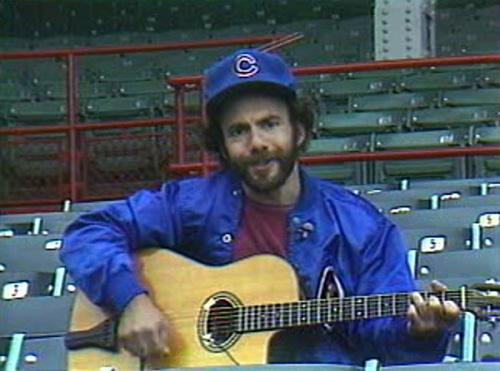In this image released by WBBM-TV, singer Steve Goodman performs one of his songs about the Chicago Cubs on July 28 in an empty Wrigley Field in Chicago during the 1981 baseball strike. Goodman was a native Chicagoan and lifelong Cubs fan who wrote and re THE ASSOCIATED PRESS

