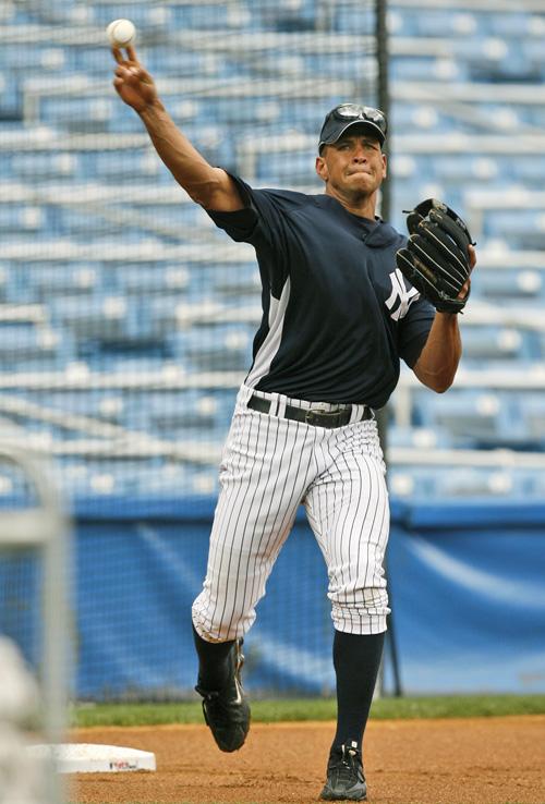 Alex Rodriguez tosses his bat in the air after hitting a two-out, walk-off, three-run home run at Yankee Stadium in New York in this April 19 file photo. Rodriguez is a free agent. THE ASSOCIATED PRESS, KATHY WILLENS
