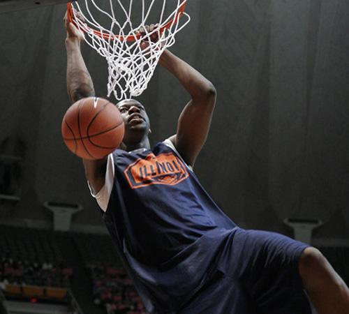 Illinois center Shaun Pruitt dunks during the Midnight Madness scrimmage on Friday in Assembly Hall. Erica Magda
