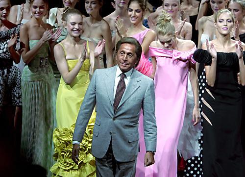 Italian fashion designer Valentino acknowledges applause at the end of the presentation of his Spring/Summer 2008 Ready to Wear collection in Paris on Wednesday. Valentino announced last month he would retire in 2008 after one final show, a haute couture THE ASSOCIATED PRESS, REMY DE LA MAUVINIERE
