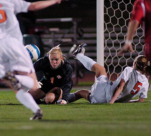 Illinois goalkeeper Lindsey Carstens, center, stops a shot on goal during the game against Indiana on Friday. Erica Magda
