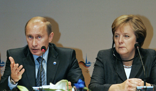 German Chancellor Angela Merkel, right, and Russian President Vladimir Putin attend the Petersburg Dialogue at the Kurhaus resort on Monday. THE ASSOCIATED PRESS, MKAHAIL KILMENTYEV
