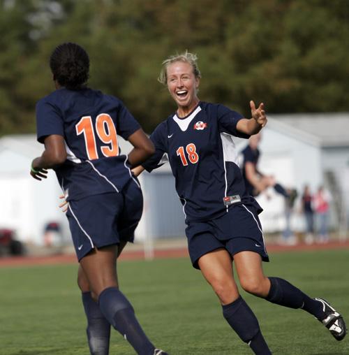 Cory Steigerwald, right, runs to embrace teammate Charlotte Cooke after Cooke scored her first goal of the season against Wisconsin at Illinois Soccer and Track Stadium on Sunday. Illinois shut out Wisconsin 3-0. Laura Prusik
