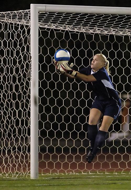 Illinois goalkeeper Lindesy Carstens scoops up the ball during the game at Illinois Soccer and Track Stadium on Saturday. Erica Magda
