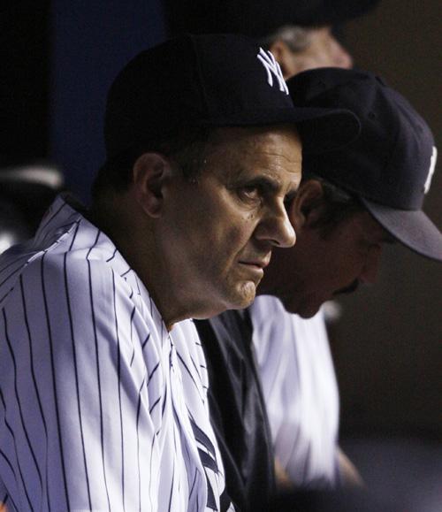 New York Yankees manager Joe Torre watches from the dugout against the Cleveland Indians during Game 4 on Monday at Yankee Stadium in New York. Torre may be fired following yet another fruitless Yankee postseason. THE ASSOCIATED PRESS, KATHY WILLENS
