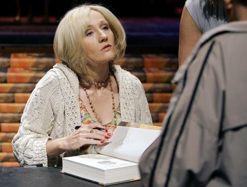 Author J.K. Rowling signs copies of Harry Potter and the Deathly Hallows for 1,600 public school children Monday, at the Kodak Theatre in Los Angeles. Rowling is on tour to promote the seventh and final Harry Potter book. Ric Francis, The Associated Press
