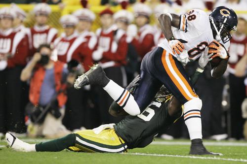 Chicago Bears tight end Desmond Clark (88) runs over Green Bay Packers safety Nick Collins for the game-wining touchdown during the second half of a game Sunday, in Green Bay, Wis. The Bears won 27-20. THE ASSOCIATED PRESS, MORRY GASH
