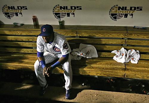 Cubs outfielder Felix Pie sits in the dugout after the Cubs lost to the Arizona Diamondbacks 5-1 in Game 3 of the NLDS on Saturday at Wrigley Field in Chicago. The Cubs, who won the NL Central following a last-place finish in 2006, were swept from this ye The Associated Press
