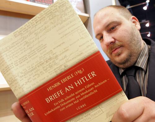 Author Henrik Eberle is seen with his book Briefe an Hitler (Letters to Hitler) at the Book Fair in Frankfurt, central Germany, Wednesday. Historian Eberle has compiled 300 letters to Adolf Hitler in his book after he examined more than 20,000 of them Michael Probst, The Associated Press
