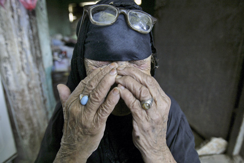 Um Aeid an Iraqi mother mourns for her three sons, one of whom was killed and two were injured, after a mortar attack, in Diwaniyah, Iraq, on Monday. THE ASSOCIATED PRESS, ALAA AL-MARJANI
