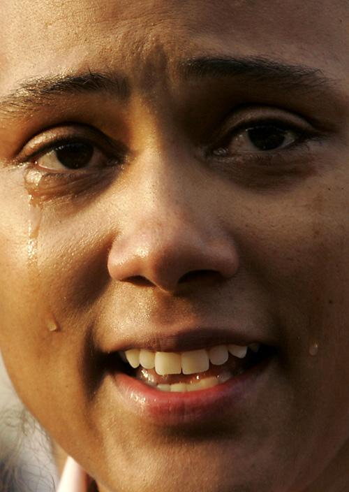 Marion Jones cries while addressing the media on Friday in White Plains, N.Y. She has now given up her medals following her admission of past steroid use. THE ASSOCIATED PRESS, MARY ALTAFFER
