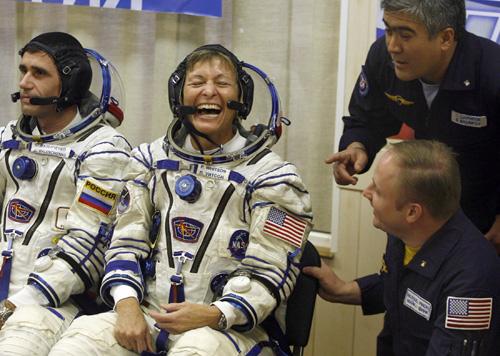 U.S. astronaut Peggy Whitson, center, commander of the 16th mission for the International Space Station, smiles just before the launch of the Russian Soyuz rocket at the Baikonur cosmodrome in Kazakhstan on Wednesday. THE ASSOCIATED PRESS, MIKHAIL METZEL
