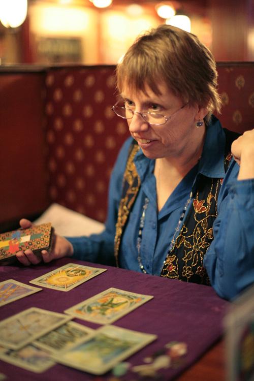 Catherine Novak explains the tarot cards exposed to Ellen Stewart, (not pictured) sophomore in Education, during a tarot card reading. Erica Magda

