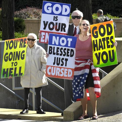 Margie M. Phelps, left, stands with her husband, Pastor Fred Phelps and her daughter, Margie J. Phelps during a demonstration outside the federal courthouse in Baltimore, Maryland, on Wednesday. Erica Magda
