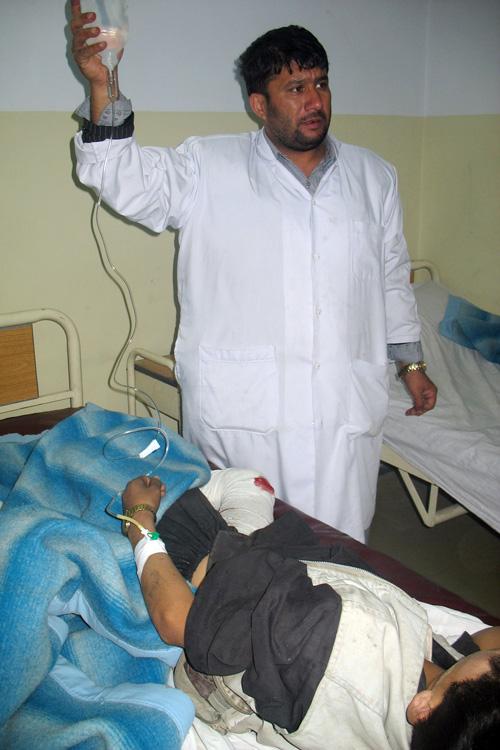 An Afghan doctor treats a boy at a hospital after a suicide attack in Baghlan province, north of Kabul, Afghanistan on Tuesday. Erica Magda
