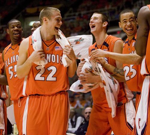 Illinois players celebrate after teammate Chris Hicks scored seven points near the end of the game against Kentucky Wesleyan at Assembly Hall on Tuesday. The Illini got off to a 15-0 start to open up the victory. Erica Magda
