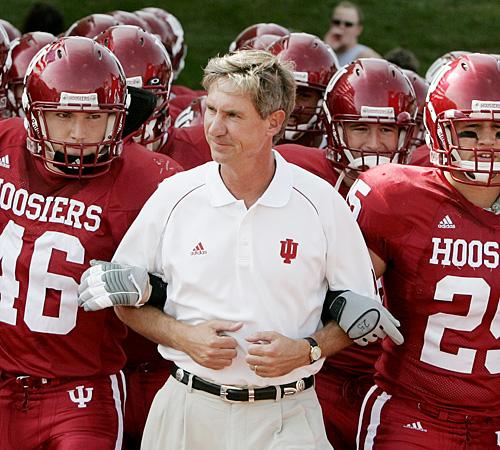 Indiana head coach Bill Lynch, center, is escorted onto the field by linebacker Jake Powers (46) and safety Eric McClurg (25) before a game against SIU. Darron Cummings, The Associated Press
