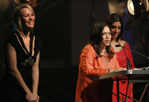 Director Mira Nair, center, speaks after receiving her tribute award from actresses Uma Thurman, left, and Tabu, right, at the 17th Annual Gotham Awards at Steiner Studios, Tuesday in New York. Evan Agostini, The Associated Press
