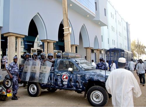Sudanese anti-riot policemen stand alert outside Khartoum court in Sudan on Thursday, where British teacher Gillian Gibbons was tried. Abd Raouf, The Associated Press
